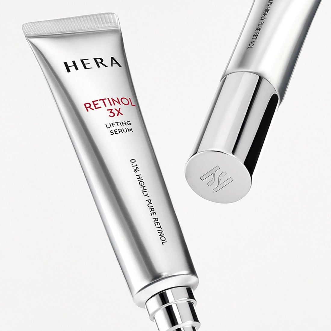 HERA Retinol 3X Lifting Serum 25ml, silver tube over white background, premium skincare product.