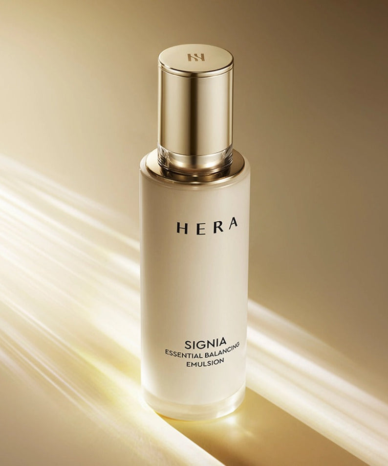 HERA Signa Essentail Balancing Emulsion 150ml bottle displayed on a golden background