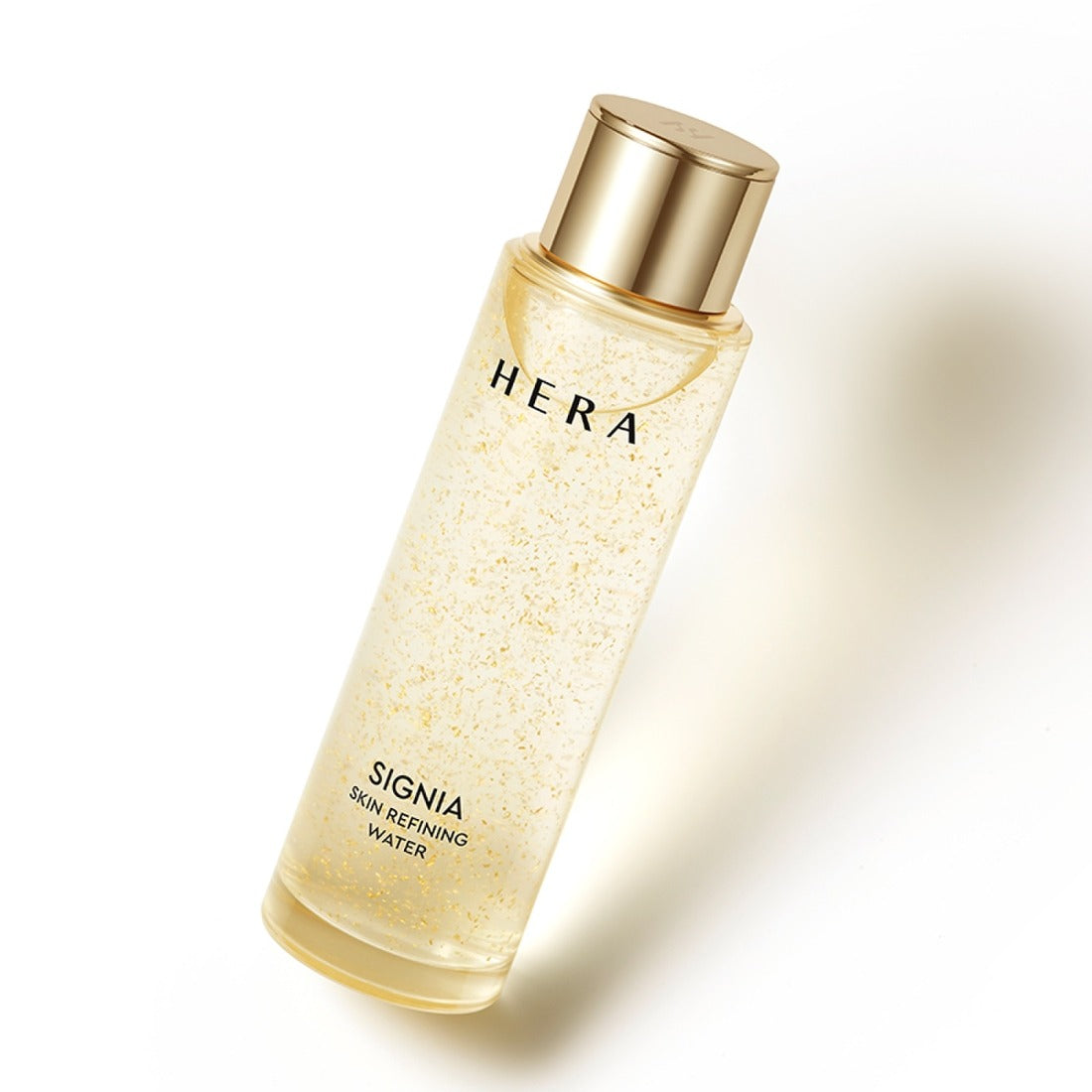 HERA Signa Skin refreshing Water 180ml bottle with golden cap on light background.