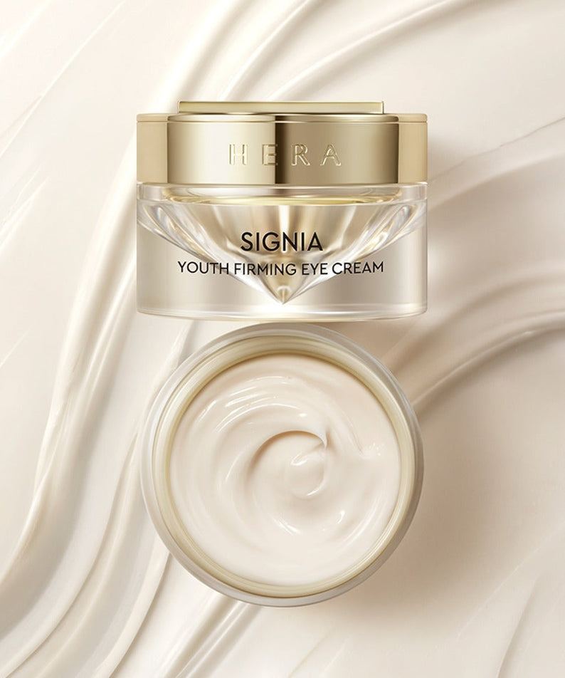 HERA Signa Youth Firming Eye Cream 30ml in an elegant jar with creamy texture, shown from top and side view on a smooth background.