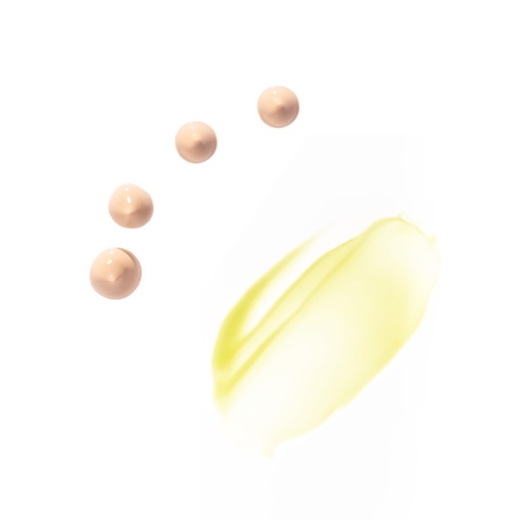 Texture of HERBLOOM Bakuchiol Dual Vita Eye Cream showing beige cream drops and yellow oil smear on white background.