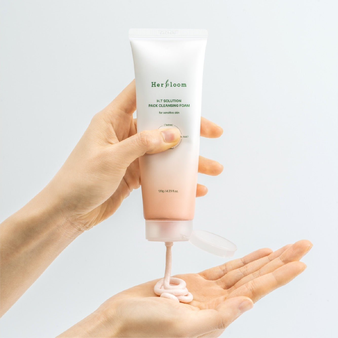 HERBLOOM H.T Solution Pack Cleansing Foam 120g being dispensed from tube into hand