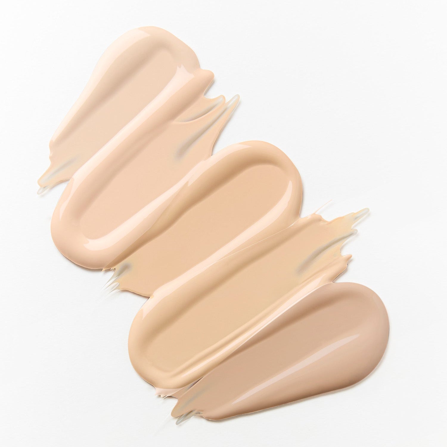 Texture of HINCE Cover Master Pink Cushion foundation in various shades on a white background.