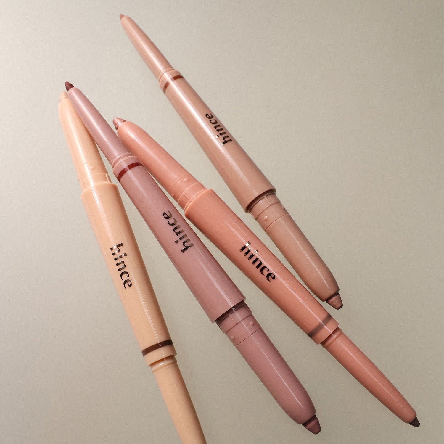 HINCE Depth Dual Color Stick lying on a neutral background, showcasing multiple shades for versatile use.