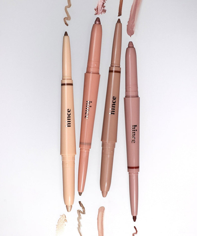 Four HINCE Depth Dual Color Stick makeup pencils in assorted shades with visible strokes on white background