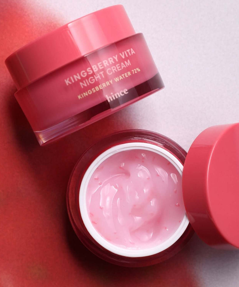 HINCE Kingsberry Vita Night Cream in pink jar with open lid on a red background.