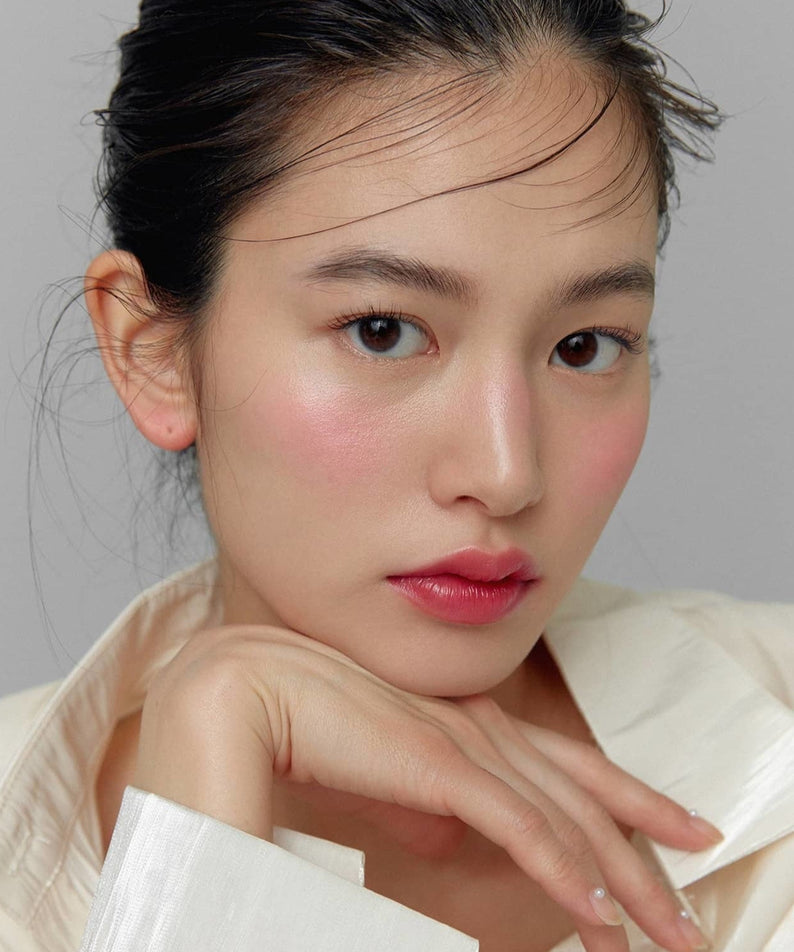 Model wearing HINCE True Dimension Glow Cheek showcasing a natural blush look.