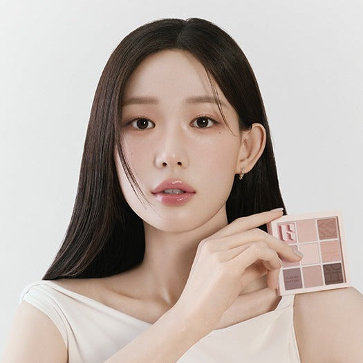 HOLIKA HOLIKA My Favorite Mood Eye Palette displayed by a model holding the palette, showcasing its range of eyeshadow colors.