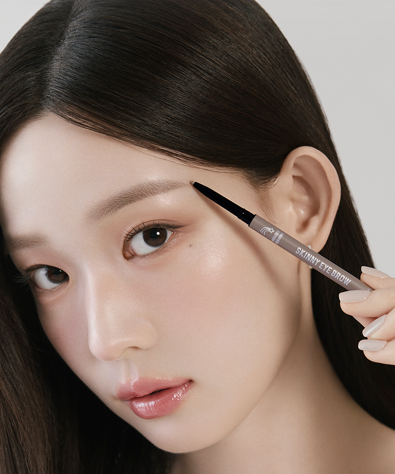 Woman applying HOLIKA HOLIKA Wonder Drawing Skinny Eyebrow 0.05g to enhance brow definition.