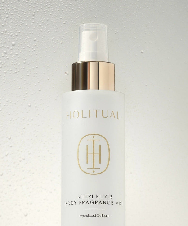 HOLITUAL Nutri Elixir Body Fragrance Mist 100ml bottle with elegant design against water droplet background