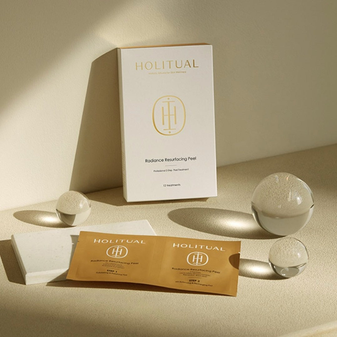 HOLITUAL Radiance Resurfacing Peel package with product and materials displayed elegantly on a beige background.