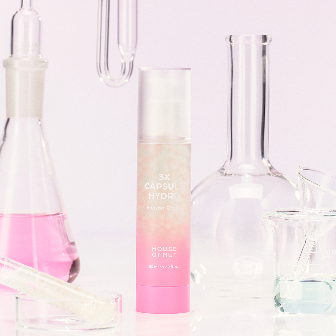 HOUSE OF HUR 3X Capsule Hydro Booster Cream 50ml with scientific glassware background