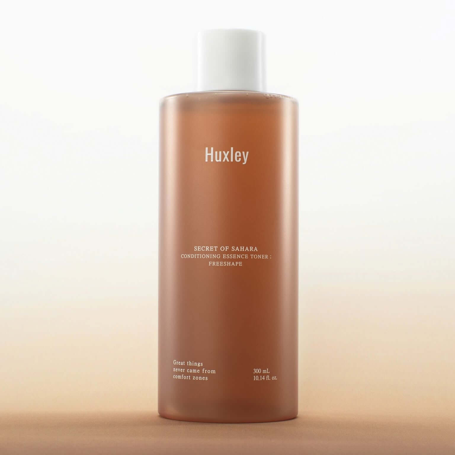 HUXLEY Conditioning Essence Toner Preshape bottle against a soft gradient background