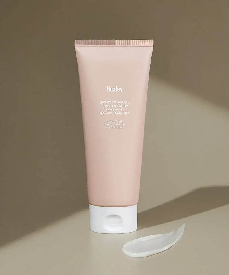 HUXLEY Intense Moisture Treatment Moroccan Gardener tube with cream swatch on brown background