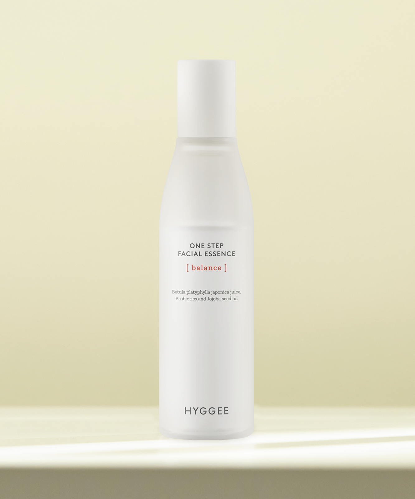 HYGGEE One Step Facial Essence 110ml bottle displayed on a smooth surface, highlighting its minimalistic and elegant design.
