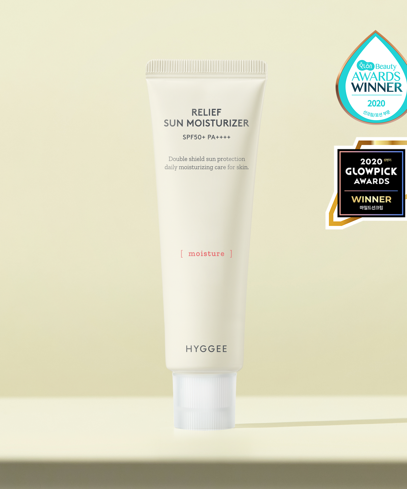 HYGGEE Relief Sun Moisturizer SPF50+ 50ml tube with award labels for daily sun protection and moisture.