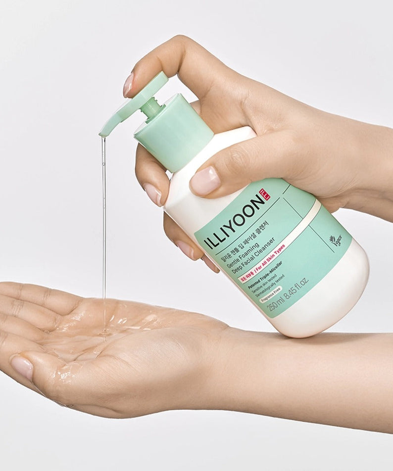 Person using ILLIYOON Gentle Deep Facial Cleanser 250ml, dispensing product into palm for skincare routine.