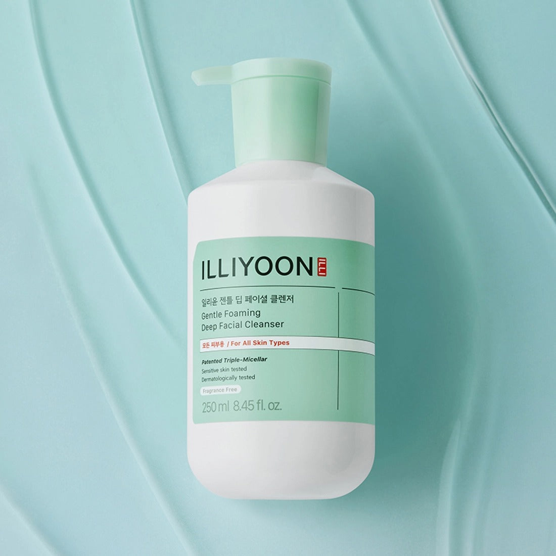Photo of ILLIYOON Gentle Deep Facial Cleanser 250ml bottle on textured blue background