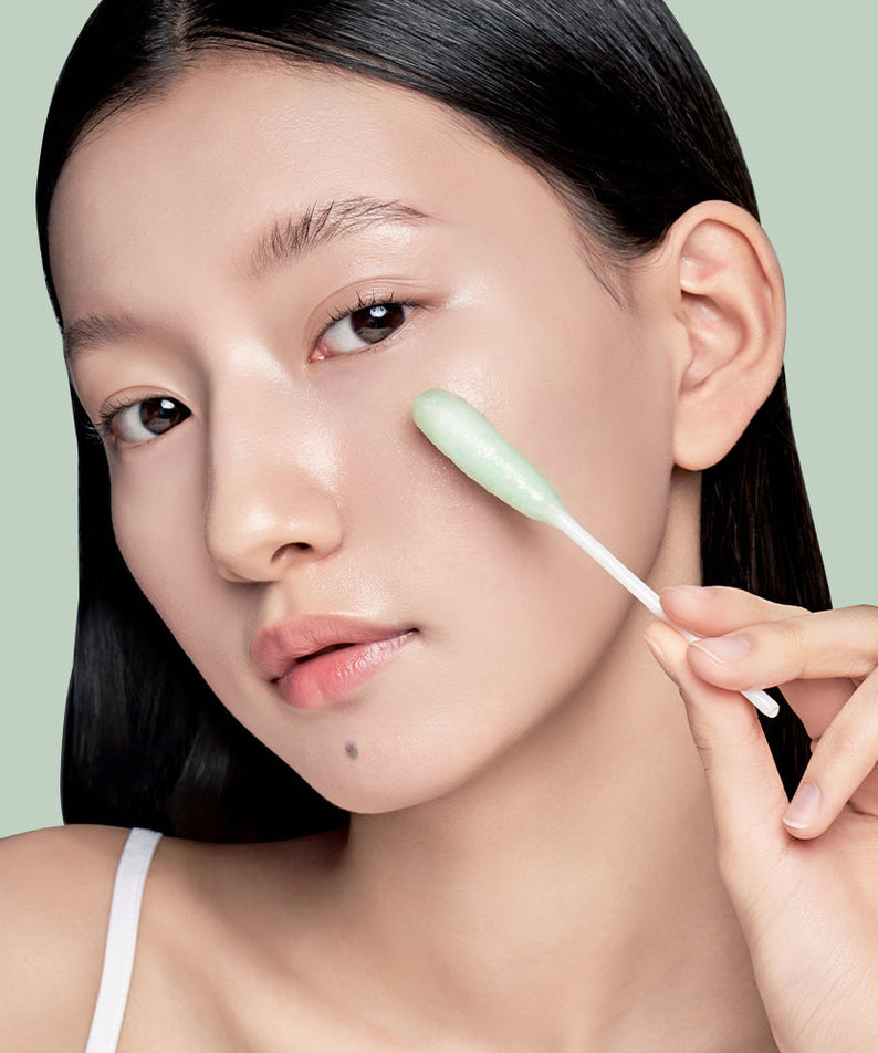 Woman using ILSO No Trouble Peeling Swab 8 sheets for skincare routine