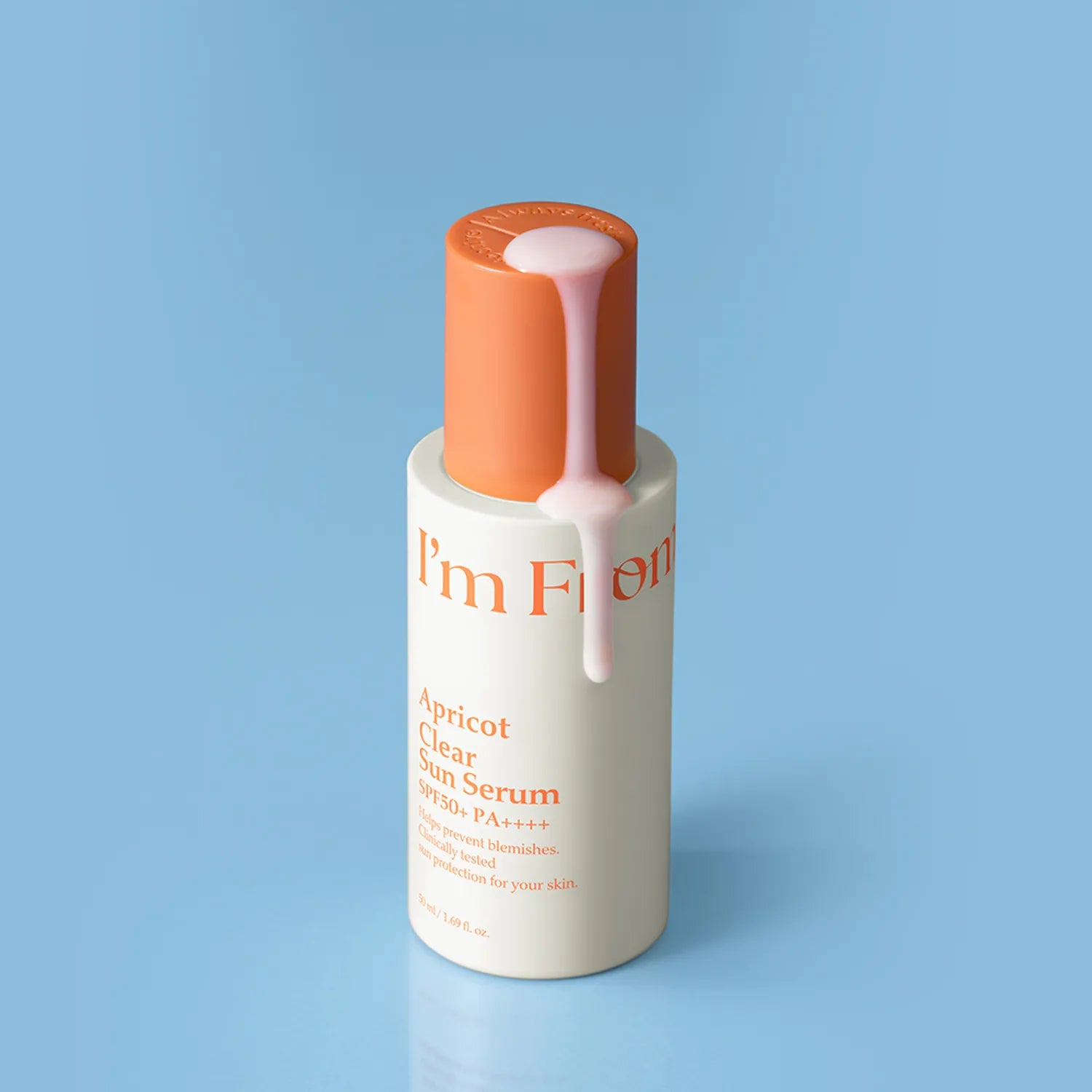 I'M FROM Apricot Clear Sun Serum 50ml bottle on blue background with product flow.
