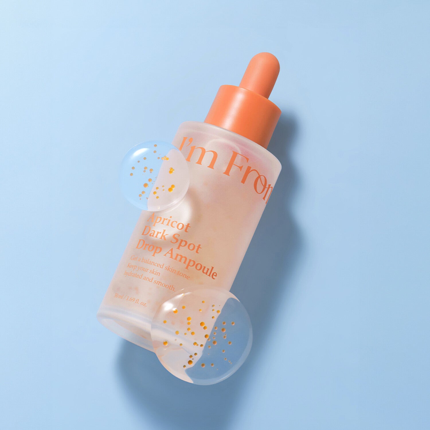 I'M FROM Apricot Dark Spot Drop Ampoule 50ml bottle on blue background