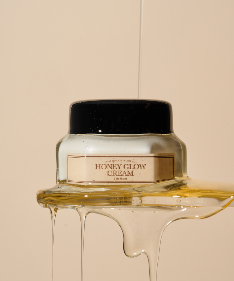 I'M FROM Honey Glow Cream 50g jar with honey drizzling over the product against a neutral background for skincare and hydration.