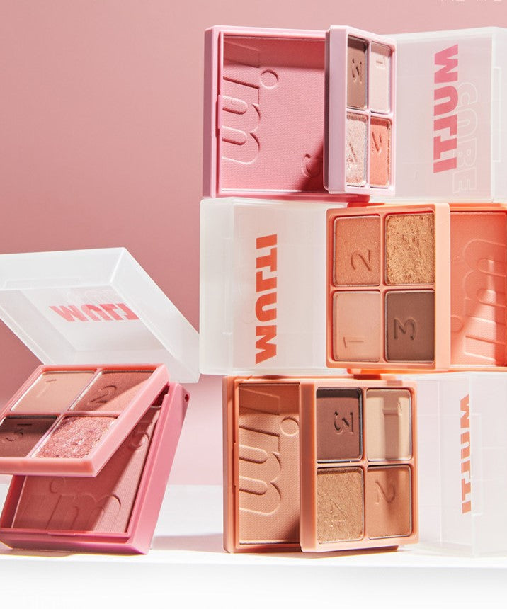 I'M MEME I'm Multi Cube makeup compacts in pink and neutral shades on a pink background