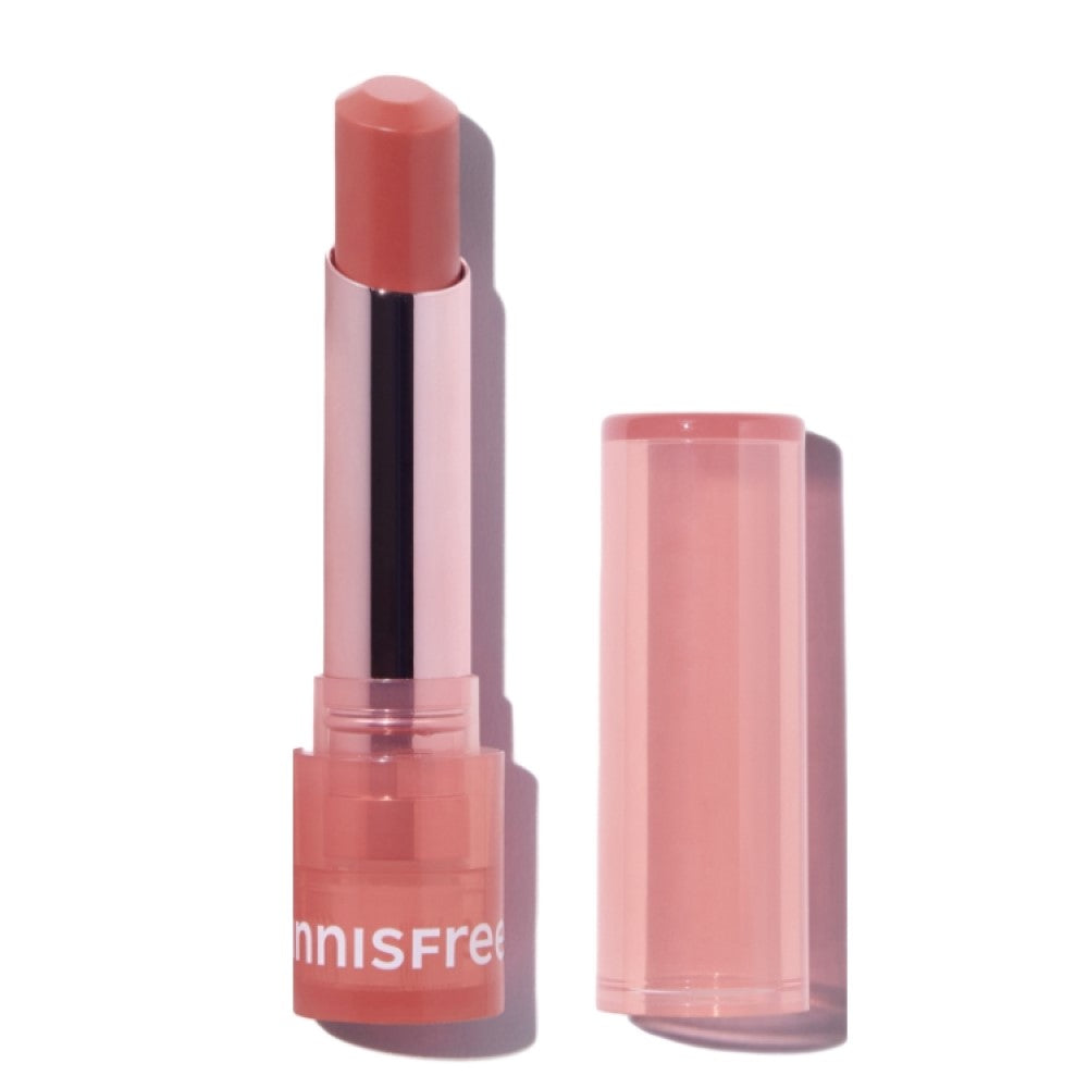 INNISFREE Dewy Tint Lip Balm 3.2g in pink packaging with open cap, showcasing the lip balm's sleek design and dewy finish.
