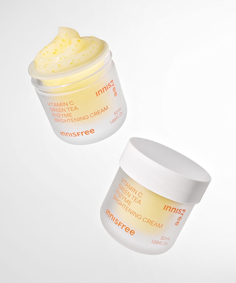 INNISFREE Vitamin C Enzyme Brightening Cream 50ml product image with jars and cream texture on a white background.