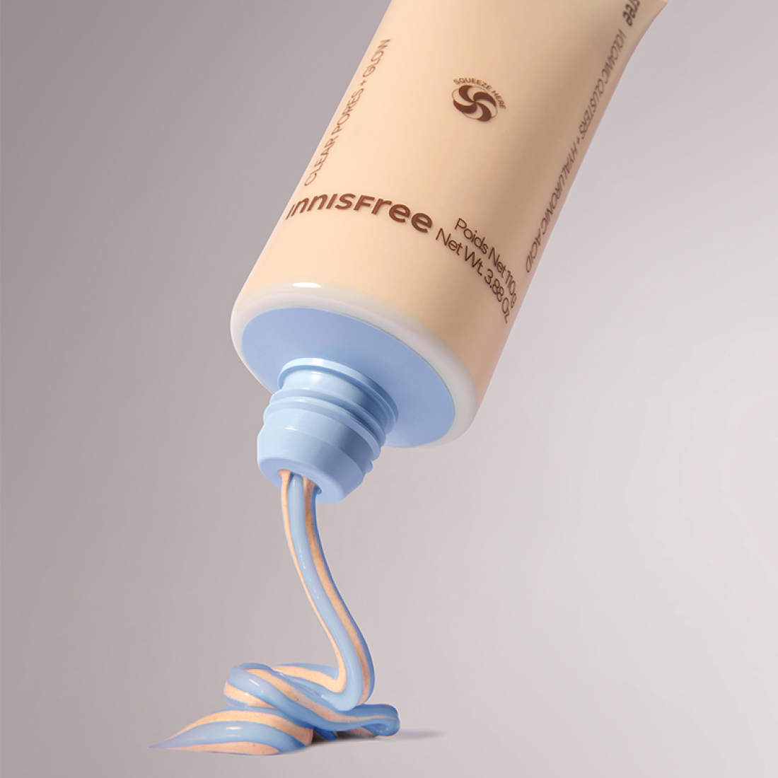 INNISFREE Volcanic Pore Dual Mask 110ml being dispensed from tube showcasing product texture.