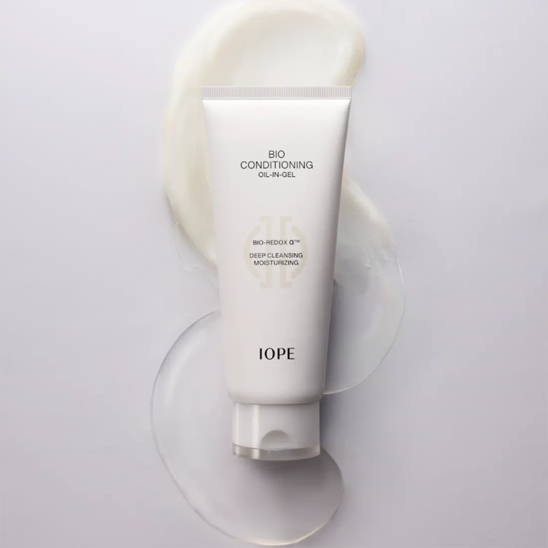 IOPE Bio Conditioning Cleansing Oil-in-Gel 150ml tube on a creamy background, showcasing deep-cleansing and moisturizing properties.