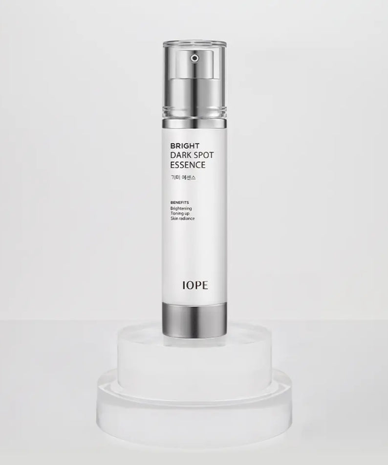 IOPE Brightening Spot Essence 45ml bottle on display, premium skincare product for dark spot correction.