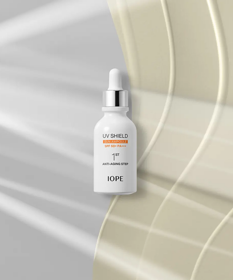 IOPE UV Sheild Sun Ampoule SPF 50+PA+++ 40ml on a sleek, modern background highlighting its anti-aging properties.