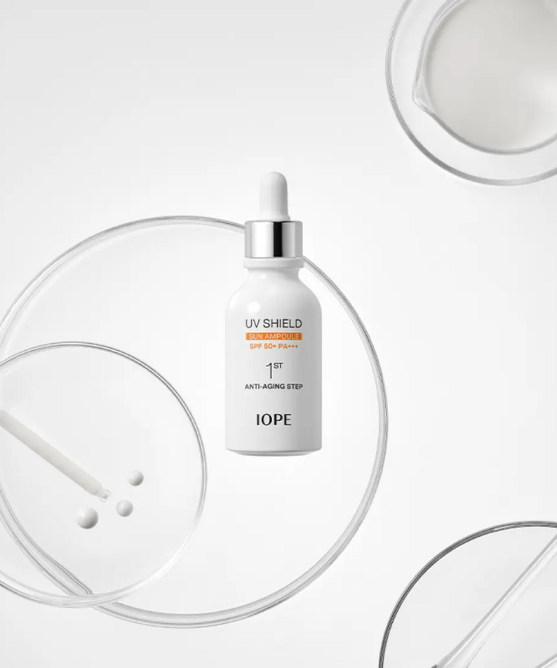 IOPE UV Sheild Sun Ampoule SPF 50+PA+++ 40ml displayed with scientific lab equipment