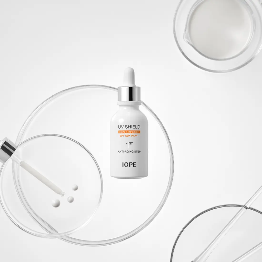 IOPE UV Sheild Sun Ampoule SPF 50+PA+++ 40ml displayed with scientific lab equipment