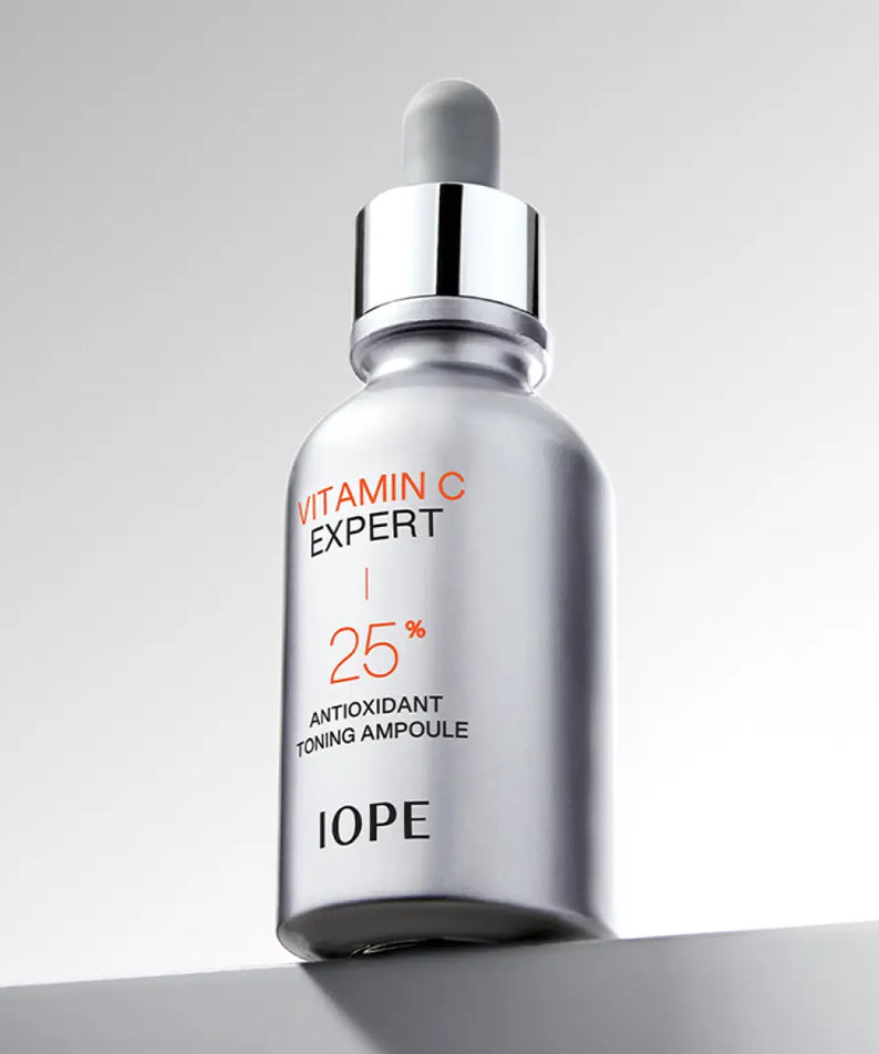 IOPE Vitamin C Expert 25% Toning Ampoule 23ml silver bottle on gray background