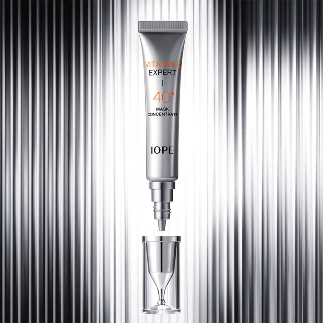 IOPE Vitamin C Expert 40% Mask Concentrate 15g on metallic background showing product tube and packaging