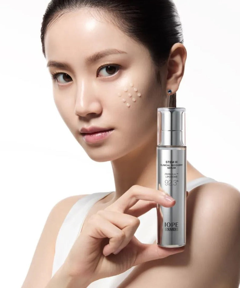 Model holding IOPE XMD Stem3 Clinic Recoery Serum 50ml