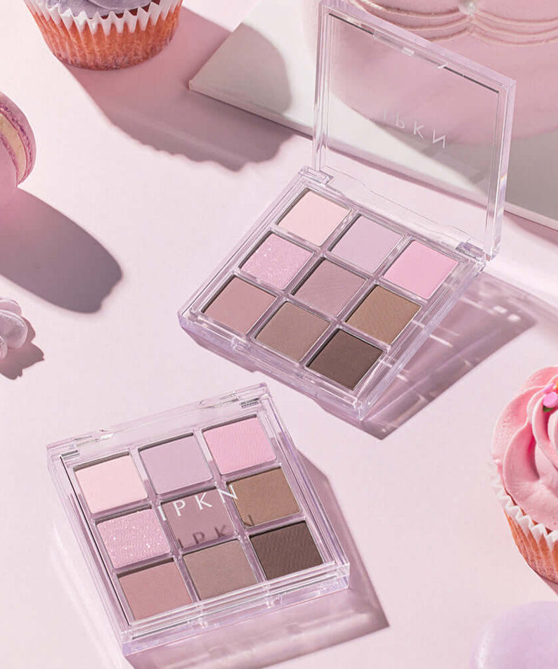 IPKN Personal Mood All Palette Cool Pressed 6.8g next to pastel macarons and cupcakes on a pink background.