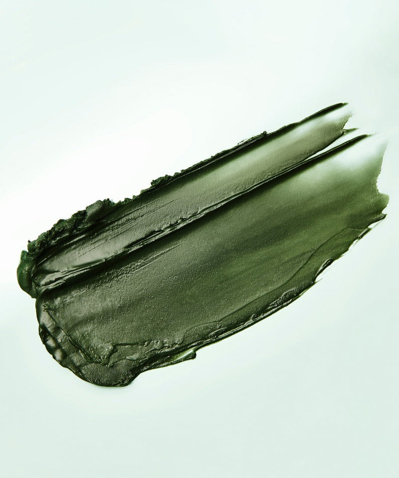 Texture of ISNTREE Mugwort Calming Deep Cleansing Balm 100g in a green smear on a light background.