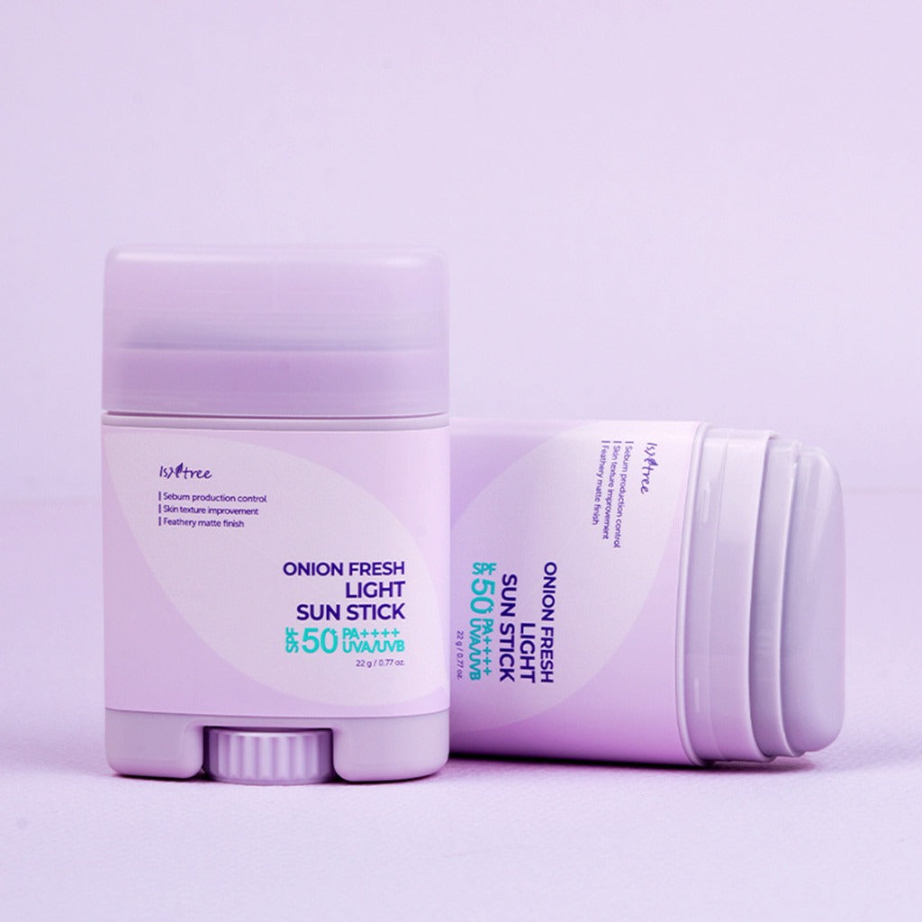 ISNTREE Onion Fresh Light Sun Stick 22g - SPF 50+ sunscreen, moisturizing and protective formula, image of product packaging in lavender.