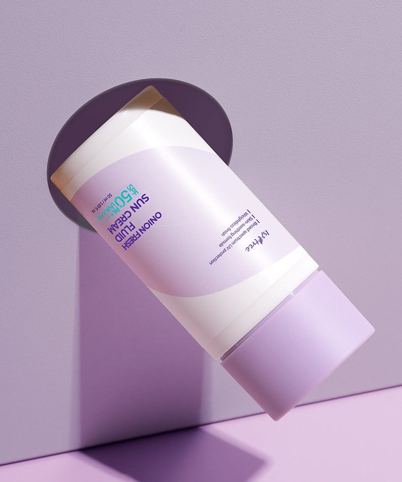 ISNTREE Onion fresh Fluid Sun Cream 50ml in sleek purple packaging against a pastel background.