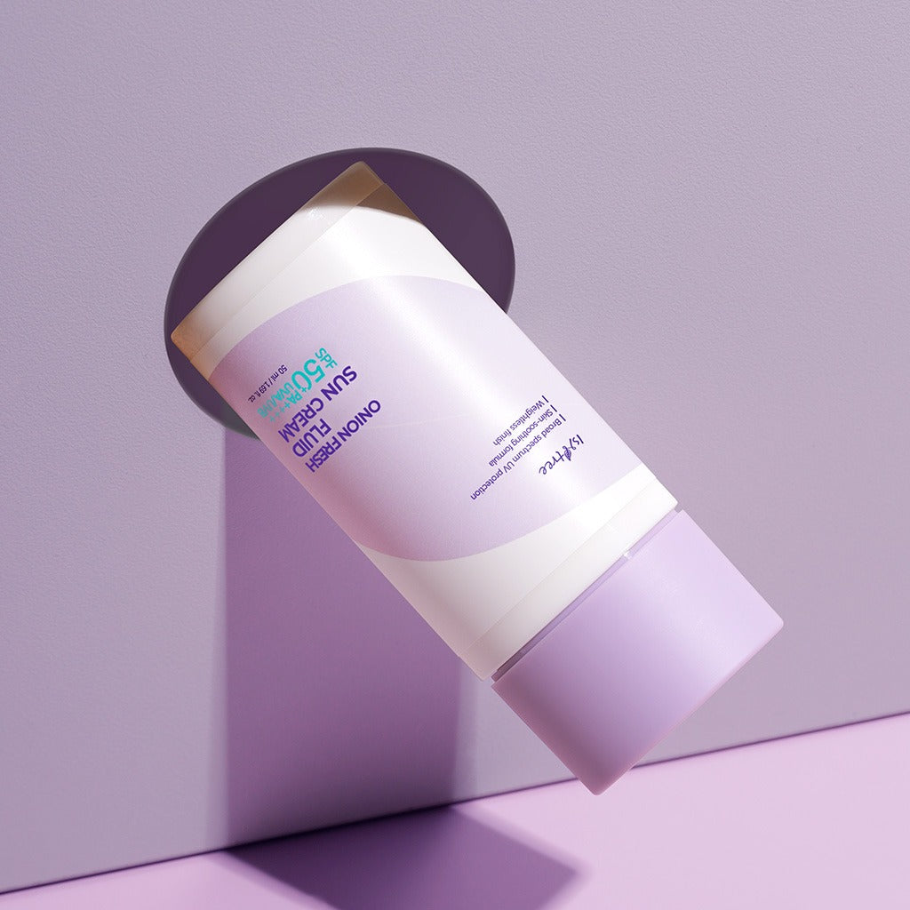 ISNTREE Onion fresh Fluid Sun Cream 50ml in sleek purple packaging against a pastel background.