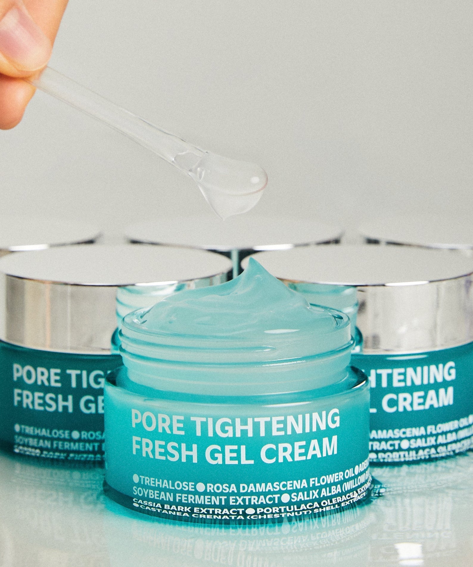 ISOI Pore Tightening Fresh Gel Cream 50ml in open jar with gel texture, featuring packaging and ingredients.