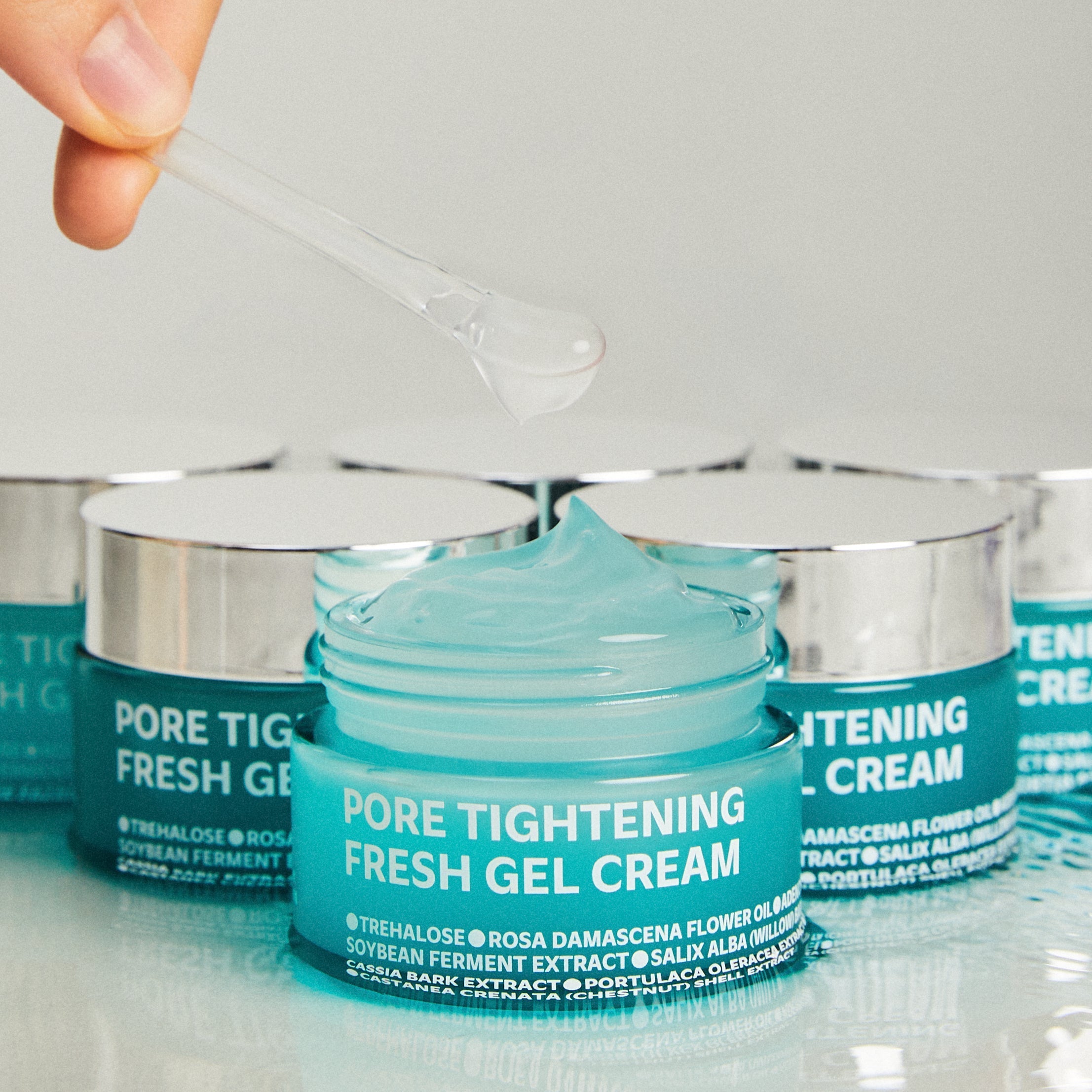 ISOI Pore Tightening Fresh Gel Cream 50ml in open jar with gel texture, featuring packaging and ingredients.