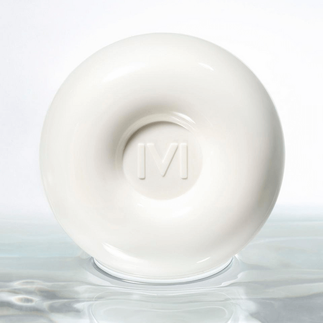IVI MAD PEACH Glazed Glow Cushion in white packaging on a reflective surface.