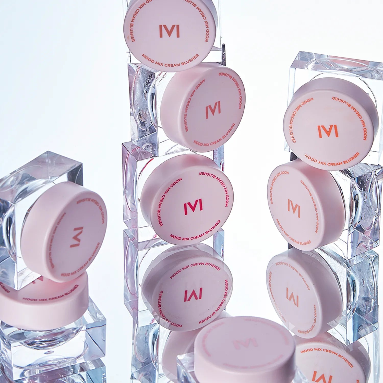 IVI MAD PEACH Mood Mix Cream Blusher collection displayed against a reflective surface for a modern aesthetic.