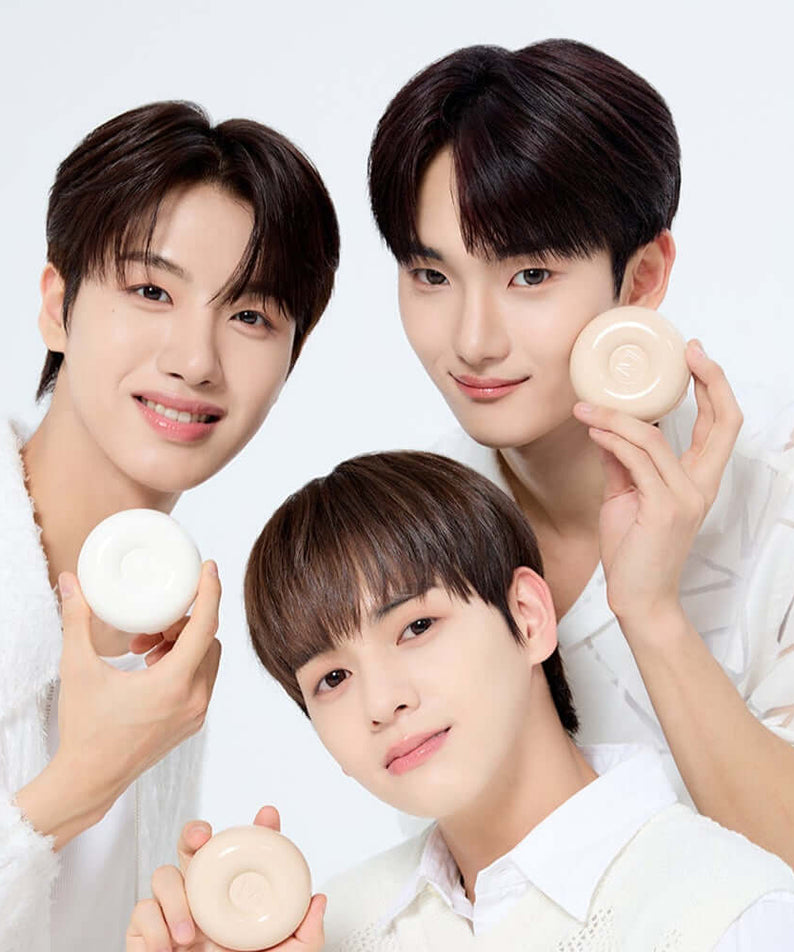 Three people holding IVI MAD PEACH Plain Velvet Matte Cushion with smiles, showcasing the product's attractive design for beauty enthusiasts.