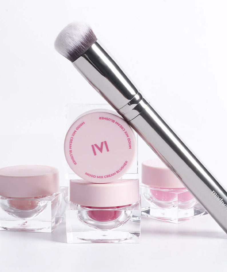 IVI MAD PEACH Soft Touch Makeup Brush with pink cosmetic containers on white background.