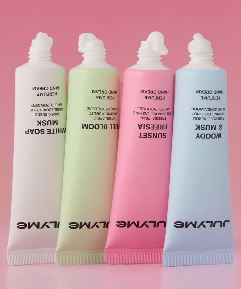 JULYME Perfume Shea Butter Hand Cream 30ml tubes in assorted colors on pink gradient background